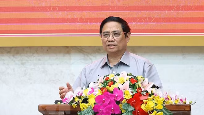 政府总理范明正在会上发表讲话。（图片来源：越通社）