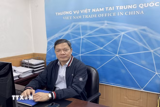 越南驻中国大使馆商务参赞农德来。