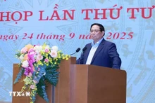 政府总理范明正在会上发言。（图片来源：越通社）