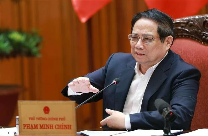 越共中央政治局委员、政府党委书记、政府总理范明正发表讲话。