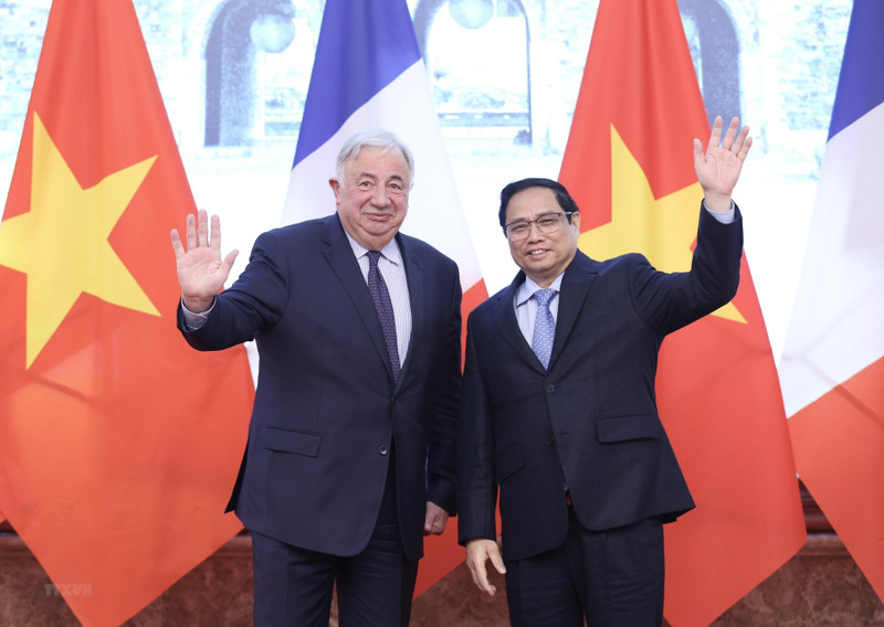 越南政府总理范明正和法国参议院议长热拉尔·拉尔歇。（图片来源：越通社）