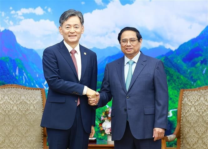 越南政府总理范明正会见韩国国家警察厅厅长赵志浩。