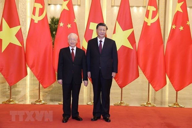 越共中央总书记阮富仲与中共中央总书记国家主席习。（图片来源：越通社）