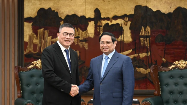 越南政府总理范明正会见中国天虹国际集团有限公司董事会主席洪天祝。