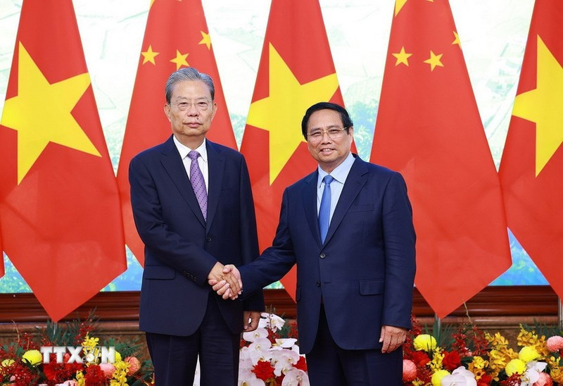 越南政府总理范明正会见中国全国人大常委会委员长赵乐际。（图片来源：越通社）