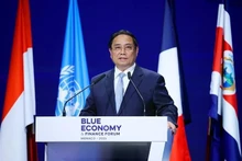 越南政府总理范明正在会上发表讲话。(图片来源:越通社)