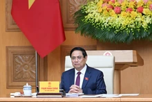 范明正总理在会上致辞。(陈海 摄)