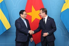 越南政府总理范明正和瑞典首相乌尔夫·克里斯特松。（图片来源：政府门户网站）