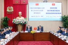 梁三光部长与王小洪部长共同主持越中公安部第九次合作打击犯罪部长级会议。