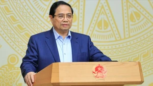 政府总理范明正在会上发表讲话。（图片来源：VGP）