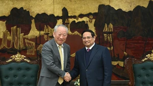 越南政府总理范明正会见中国太平洋建设集团创始人严介。