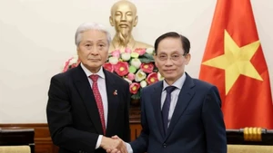 越南外交部长黎怀忠会见日本栃木县知事福田富和。（图片来源：越通社）