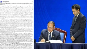 老挝国家广播电台报道老挝承诺与国际社会携手打击网络犯罪的文章。(图片来源:越通社)