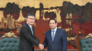 越南政府总理范明正和韩国Dunamu集团副总裁金亨年。