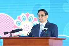 越南政府总理范明正出席越日地方合作论坛。（陈海 摄）