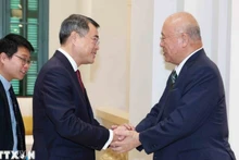 越共中央组织部部长黎明兴会见日越友好议员联盟特别顾问武部勤。（图片来源：越通社）