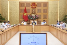 越南政府总理范明正主持召开会议。(图片来源:VGP)
