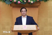 越南政府总理范明正主持2025年9月政府立法专题会议。(图片来源:越通社)