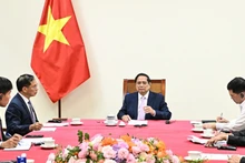 越南政府总理范明正与马来西亚总理安瓦尔·易卜拉欣通电话【组图】