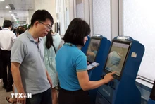 附图：12月1日起越南机场实施新规，仅托运行李及特殊旅客需柜台办理。（图片来源：越通社）