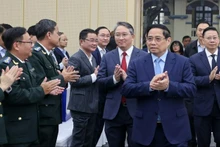 12月13日上午，越南政府总理范明正出席2025年及2021-2025年任期司法工作总结暨2026~2030年任期工作定向、2026年重点任务部署全国会议。（图片来源：越通社）