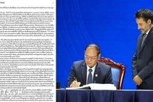 老挝国家广播电台报道老挝承诺与国际社会携手打击网络犯罪的文章。（图片来源：越通社）