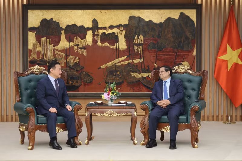 越南政府总理范明正会见三星电子公司总裁卢泰文。（图片来源：VGP）