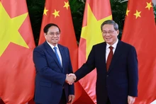 越南政府总理范明正与中国国务院总理李强。
