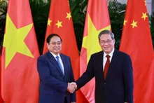 越南政府总理范明正与中国国务院总理李强。