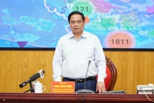 范明正总理在会上发表讲话。