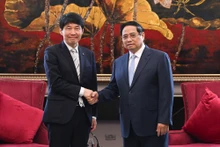 范明正总理与日本群马县知事山本一太。