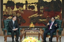 范明正总理会见老挝教育体育部长通沙立·芒诺梅。