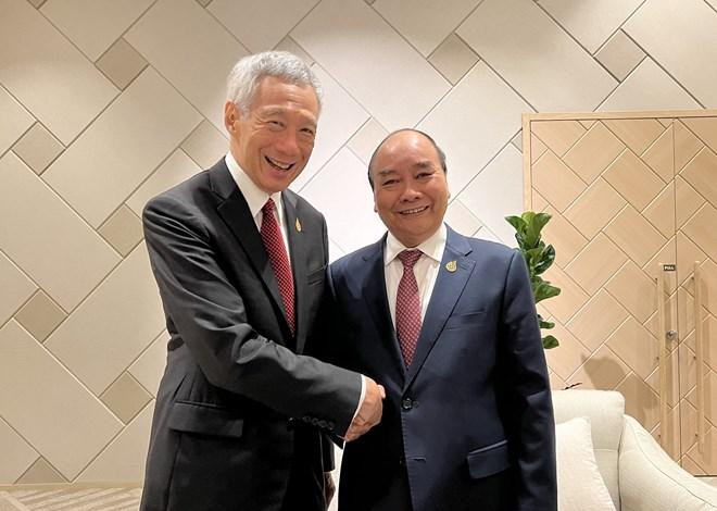 阮春福主席会见新加坡总理李显。(图片来源:越通社) 阮春福主席会见新加坡总理李显。(图片来源:越通社)