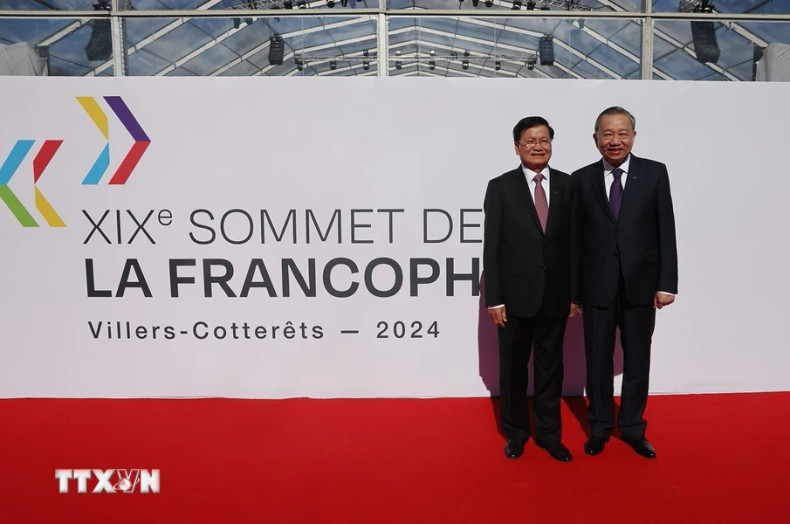 苏林总书记、国家主席和老挝人民革命党中央总书记、国家主席通伦·西苏里出席第十九届法语国家组织首脑会议开幕式。（图片来源：越通社）