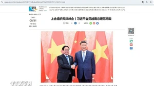 新华社刊登有关中国国家主席习近平会见越南政府总理范明正的文章。