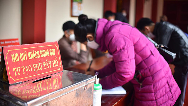 河内人正月十五出去烧香拜佛 祈求平安（组图） ảnh 9