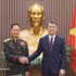 越南政府总理黎明兴会见老挝政府副总理兼国防部长坎良·奥萨宋大将。（图片来源：越通社）