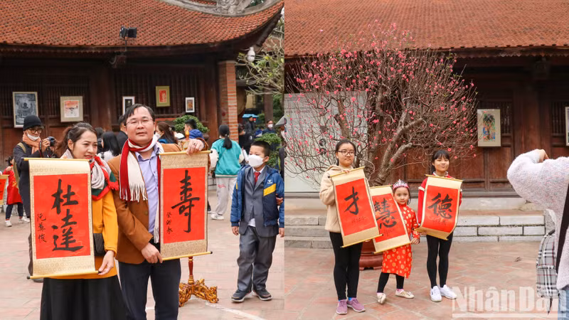 许多家庭带子孙来到这里，让他们更加了解越南的书法艺术。