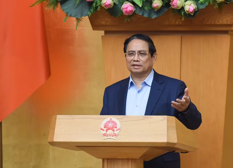 越南政府总理范明正在会上致辞。（陈海 摄）