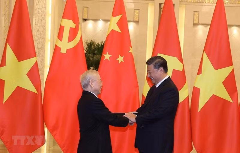 阮富仲总书记和中共中央总书记、中国国家主席习近平。（图片来源：越通社）