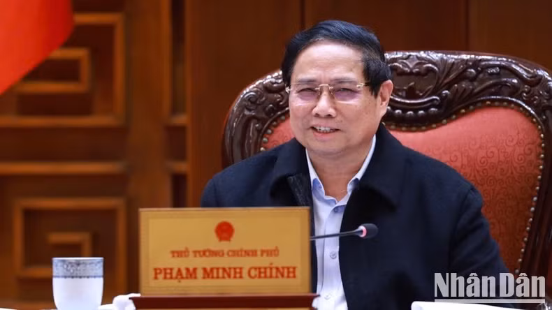 范明正总理在会上发表讲话。